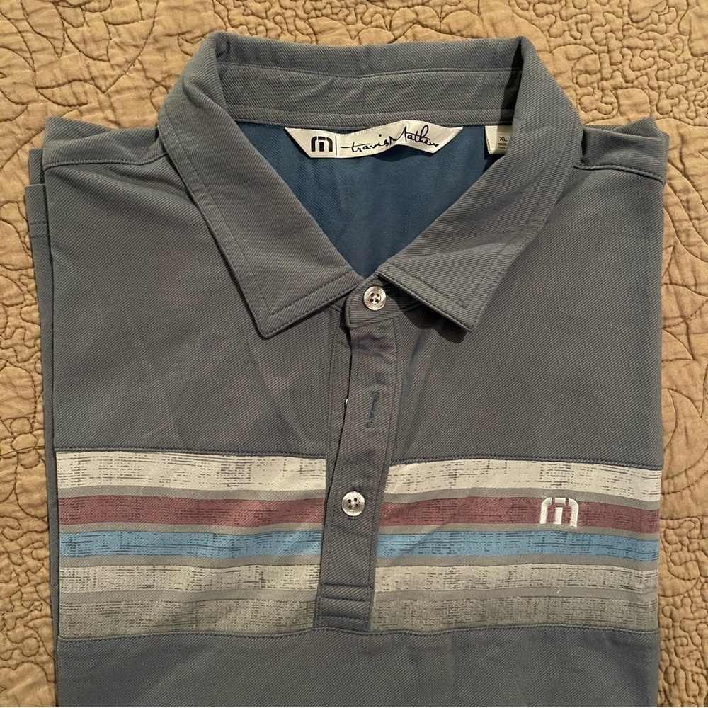Travis Matthew’s Polo Shirt. Grey/Blue with Horizontal stripes. Size X-Large.